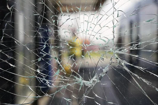 Upclose of a shattered glass pane.